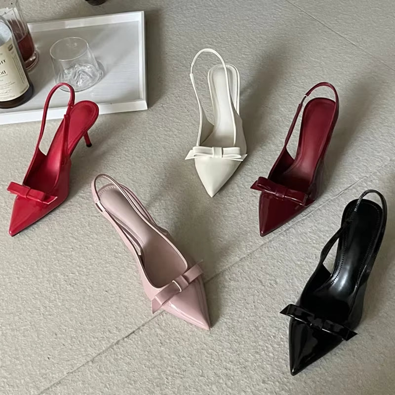mules élégantes femme, slingback vernis imperméable, sandales classiques en cuir, escarpins mule soirée, chaussures femme talon 7 cm, sandales avec plateforme confort, chaussures bout pointu chic, sandales imperméables vernies, escarpins artisanaux femme, sandales soirée 2025 tendance